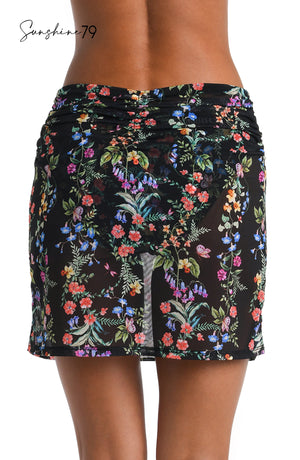 
            
                Load image into Gallery viewer, Model is wearing a multicolored Mini Skirt Cover Up
            
        