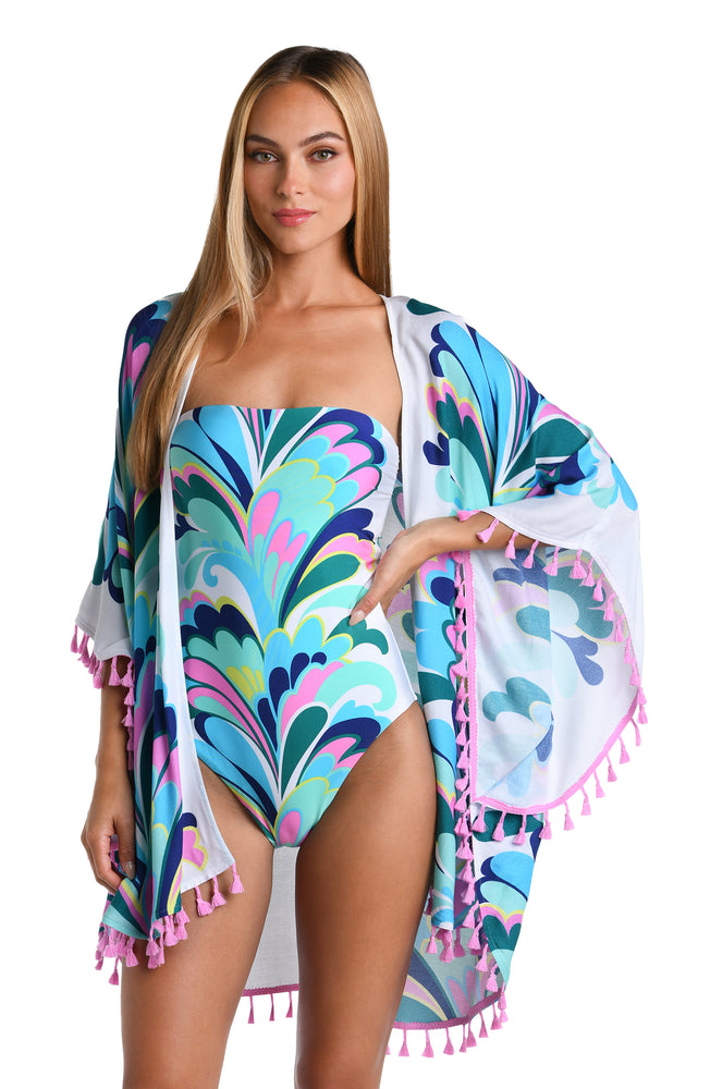 Model is wearing a white, blue, green, and pink multicolored floral printed Open Front Kimono