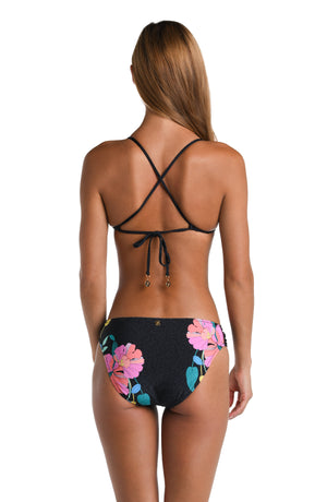 Model is wearing a black, pink, and green multicolored floral patterned Side Shirred Hipster Bottom