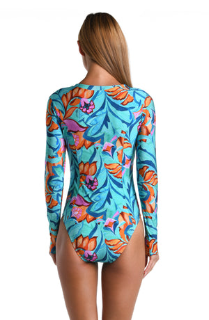 Model is wearing a turquoise, blue, coral multicolored floral printed Paddlesuit One Piece