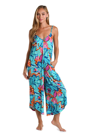 Model is wearing a turquoise, blue, coral multicolored floral printed Jumpsuit Cover Up