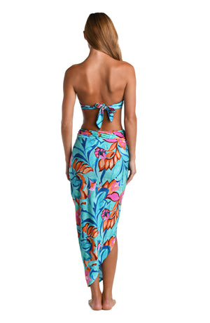 Model is wearing a turquoise, blue, coral multicolored floral printed Pull-On Faux Pareo Cover Up