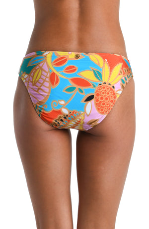 Model is wearing a pink, orange, blue, and yellow multicolored tropical printed Hipster Bottom