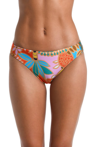 Model is wearing a pink, orange, blue, and yellow multicolored tropical printed Hipster Bottom