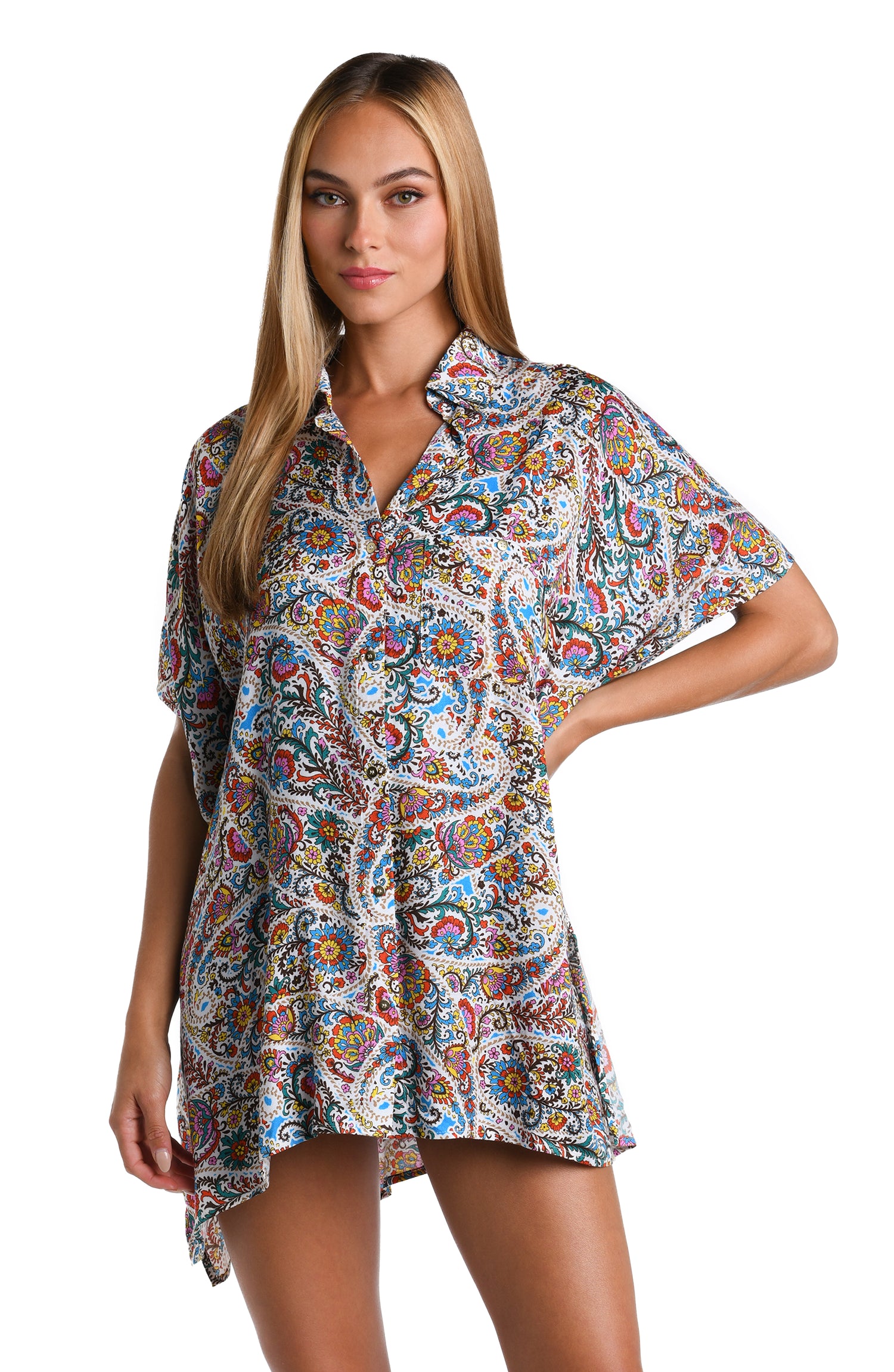 Model is wearing a white, red, blue, green, and yellow multicolored paisley printed Resort Shirt Cover Up