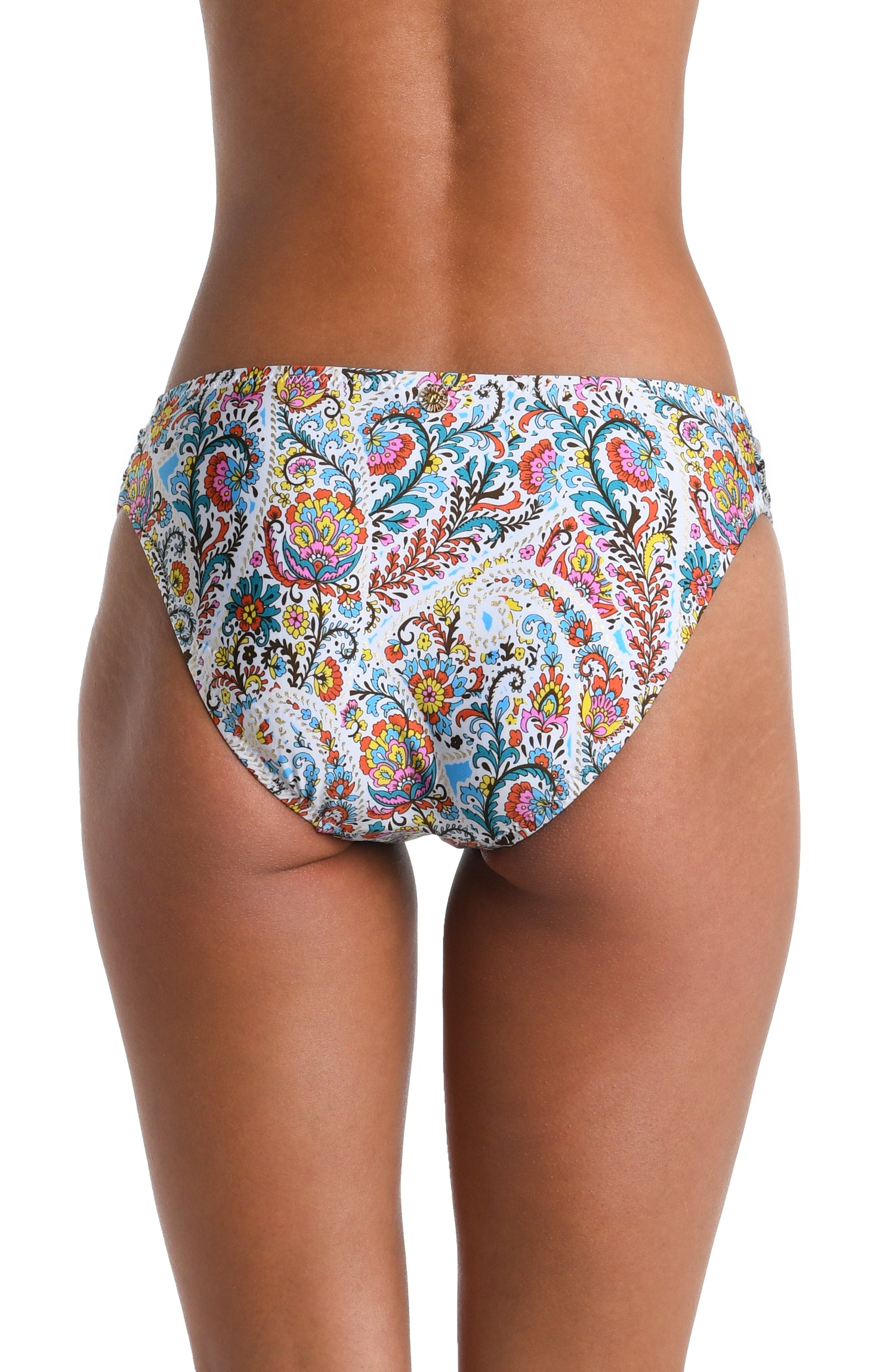 Model is wearing a white, red, blue, green, and yellow multicolored paisley printed Side Shirred Hipster Bottom