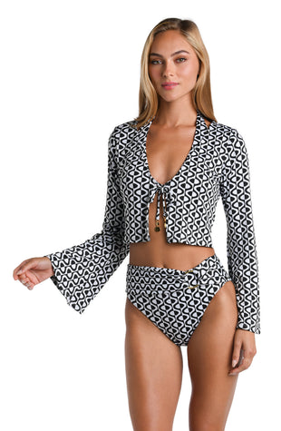 Model is wearing a black and white geometric patterned Crop Top Cover Up