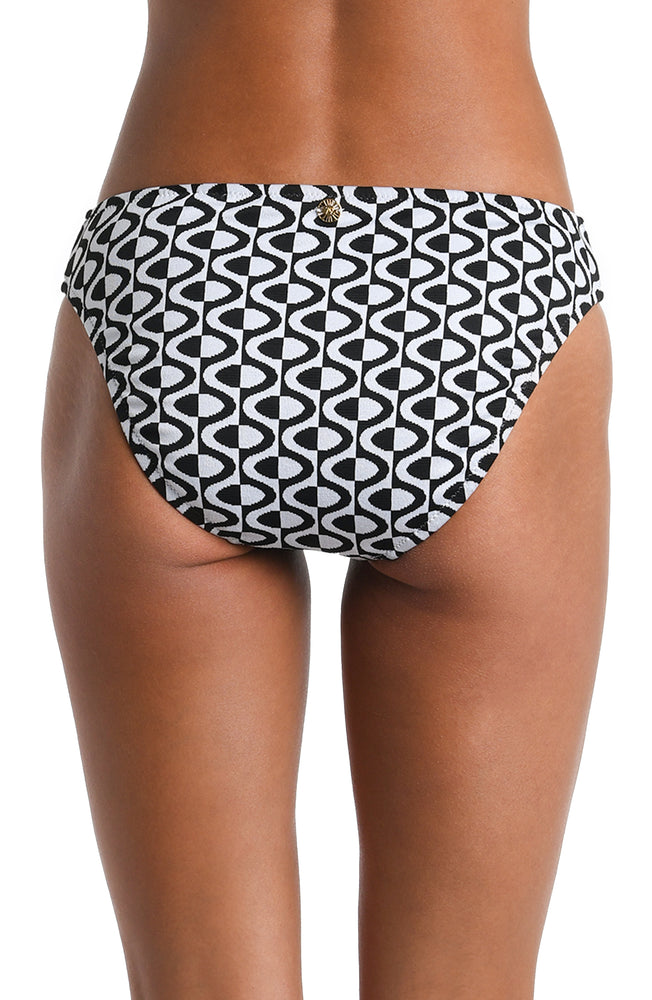 Model is wearing a black and white geometric patterned Hipster Bottom