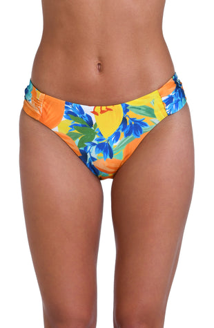 Model is wearing a blue, green, and orange multi colored floral printed side shirred hipster bottom.