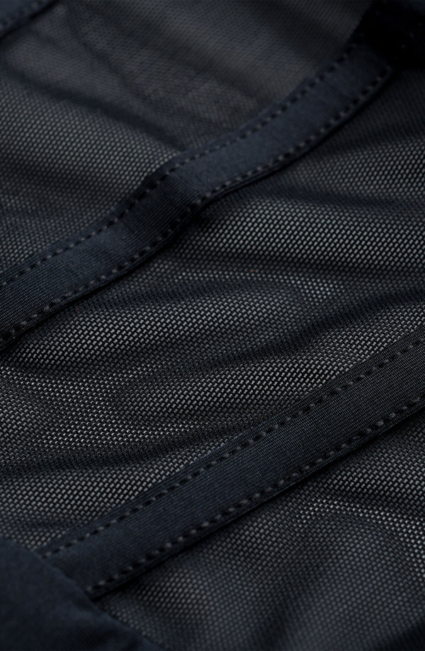 Close-up of black sheer fabric with stitching detail