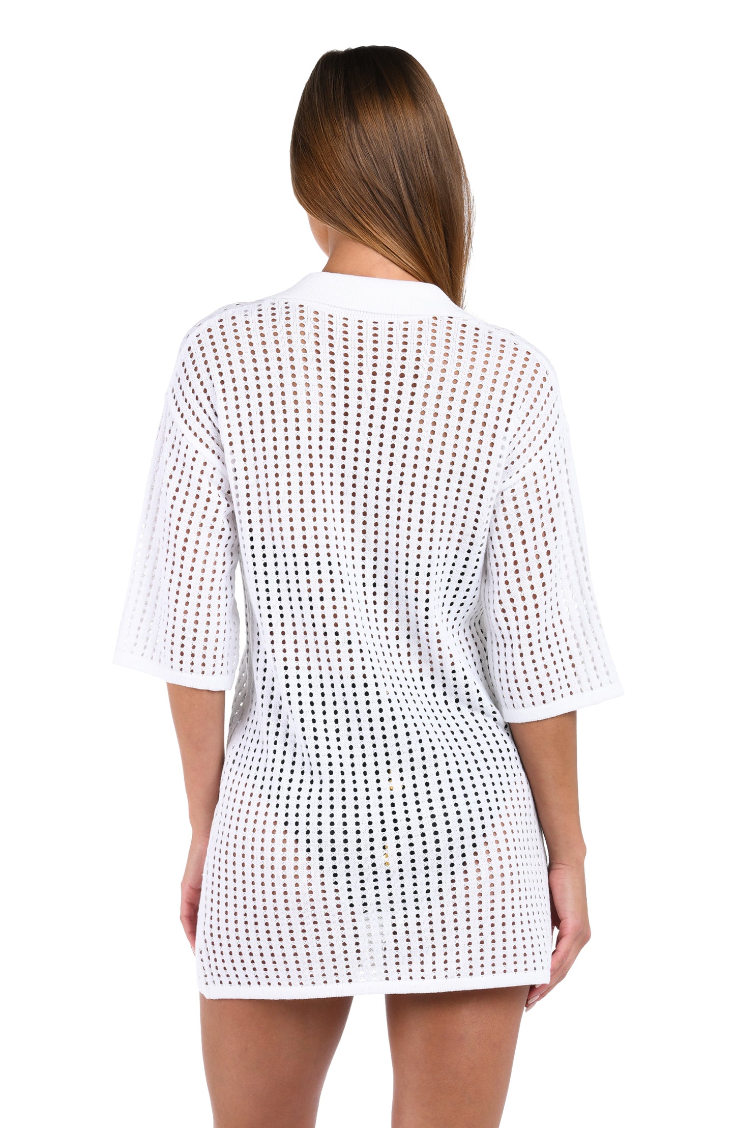 Back image of model wearing the Sunshine 79 Resort Crochet Covers V-Neck Tunic in White.