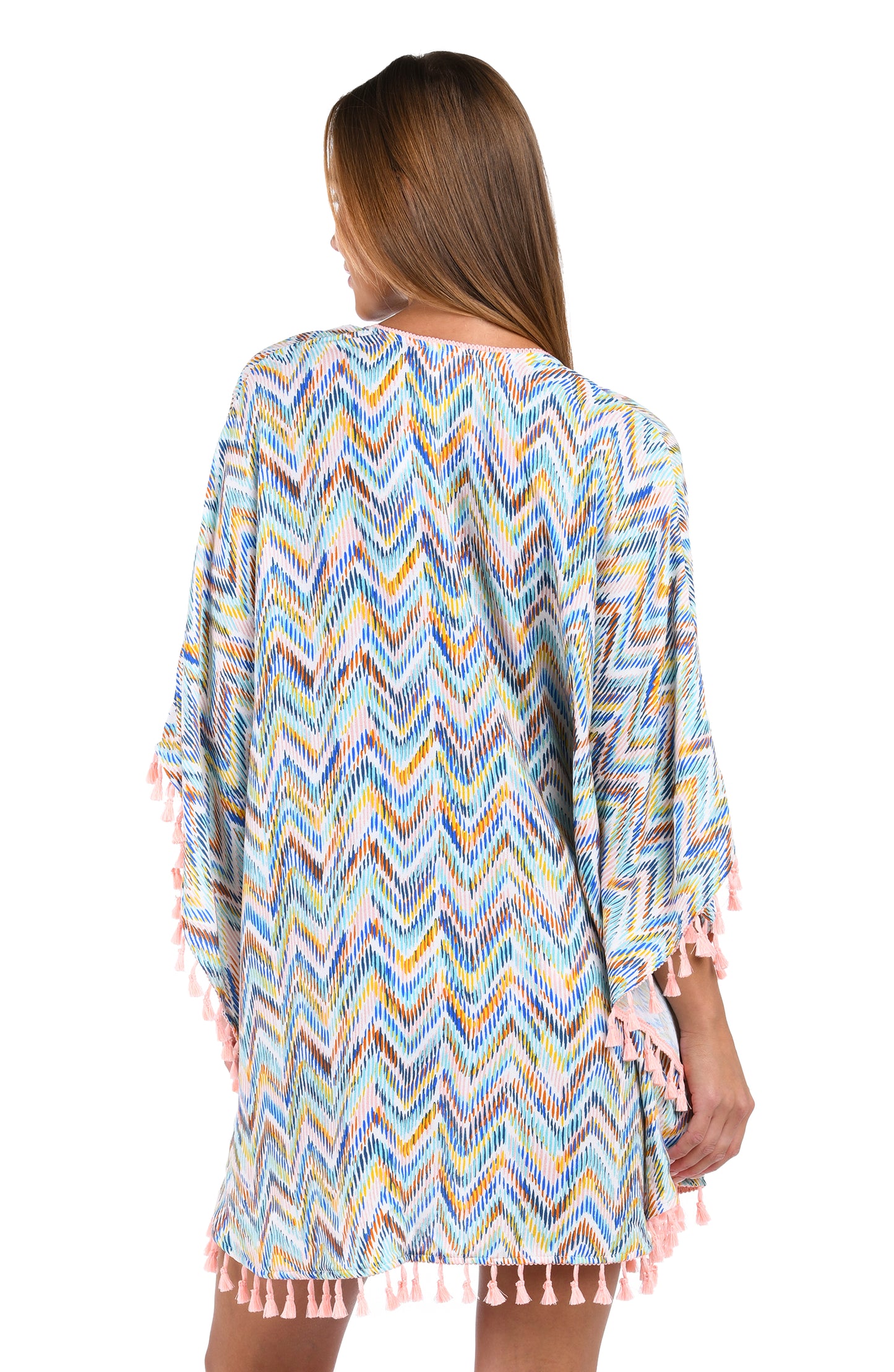 Back image of model wearing the Soul Wave Open Front Kimono in white multi colored geometrical print.