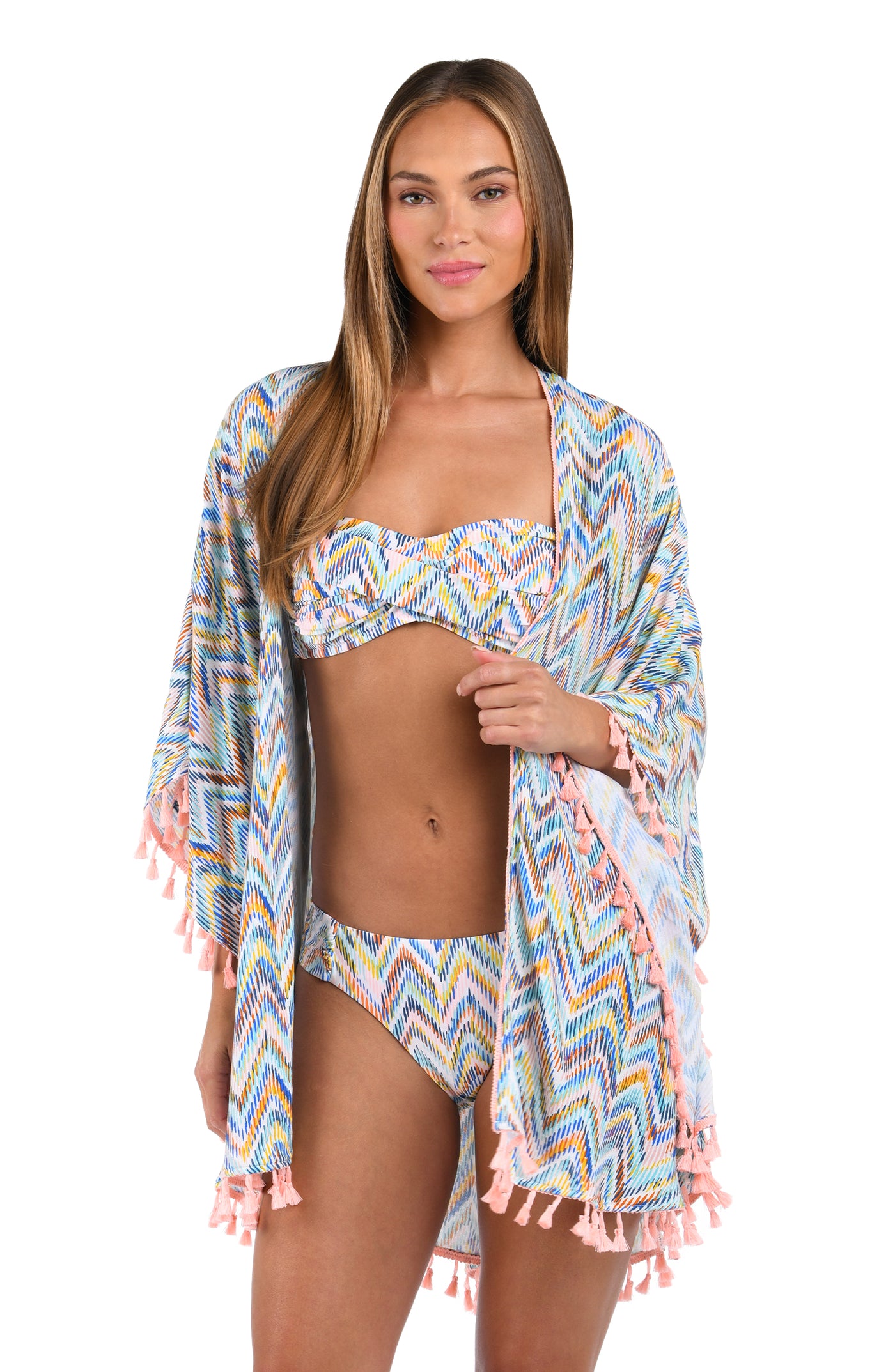 
                  
                    Front image of model wearing the Soul Wave Open Front Kimono in white multi colored geometrical print.
                  
                