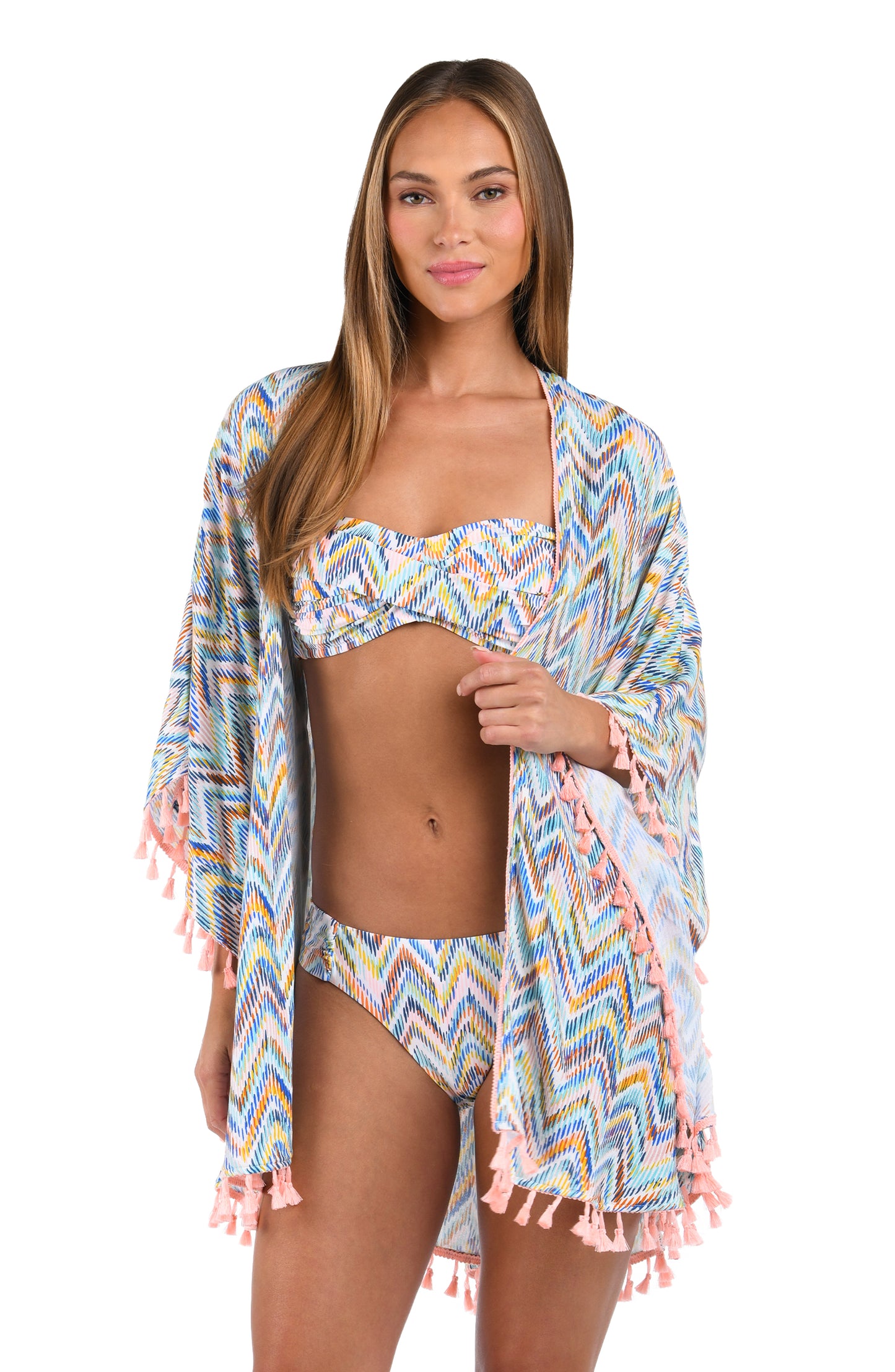 Front image of model wearing the Soul Wave Open Front Kimono in white multi colored geometrical print.