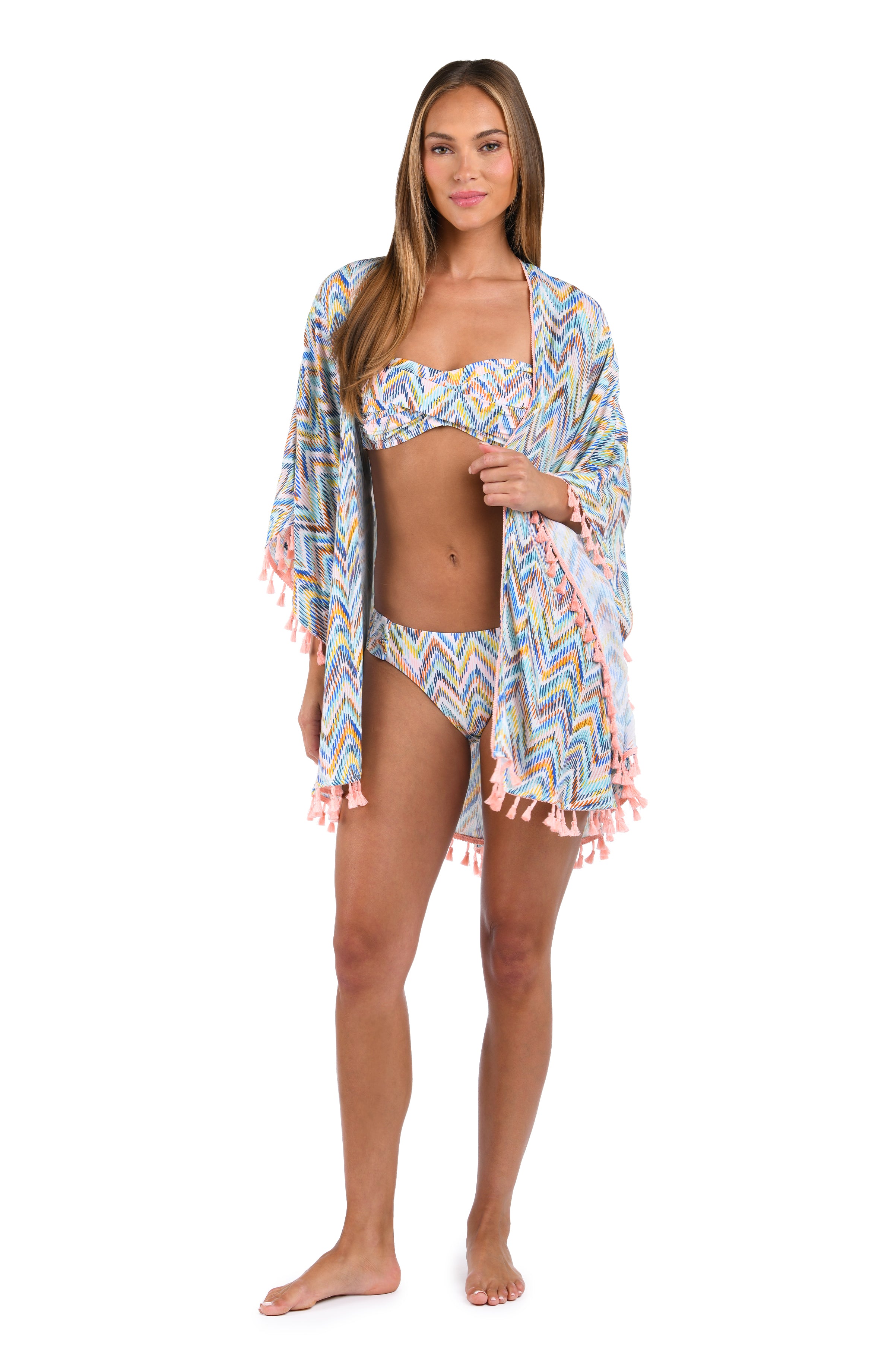 Front image of model wearing the Soul Wave Open Front Kimono in white multi colored geometrical print.