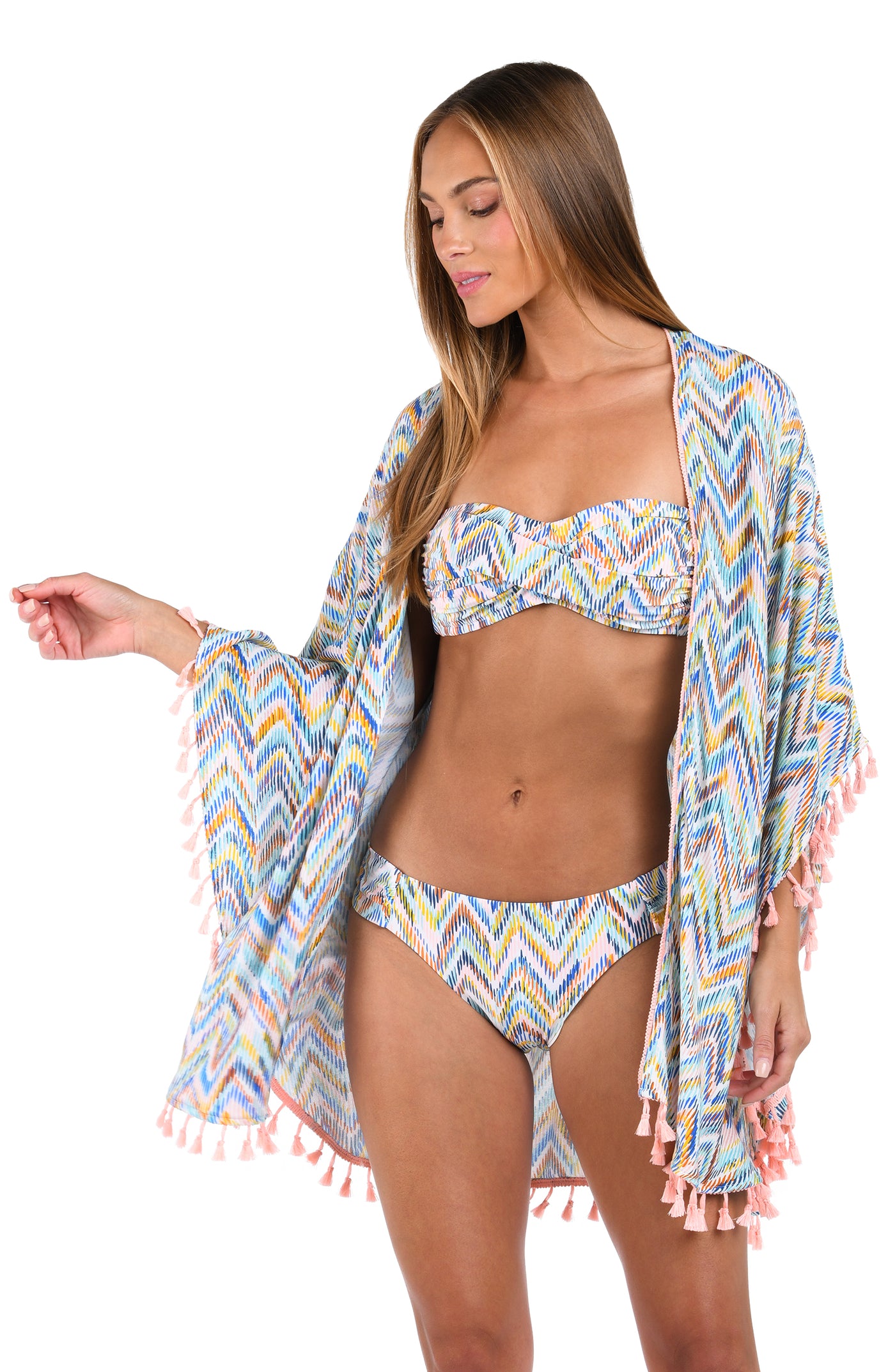 
                  
                    Front image of model wearing the Soul Wave Open Front Kimono in white multi colored geometrical print.
                  
                
