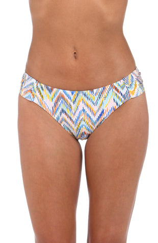 Front image of model wearing the Soul Wave  Side Shirred Hipster Bottom in white multi colored geometrical print.