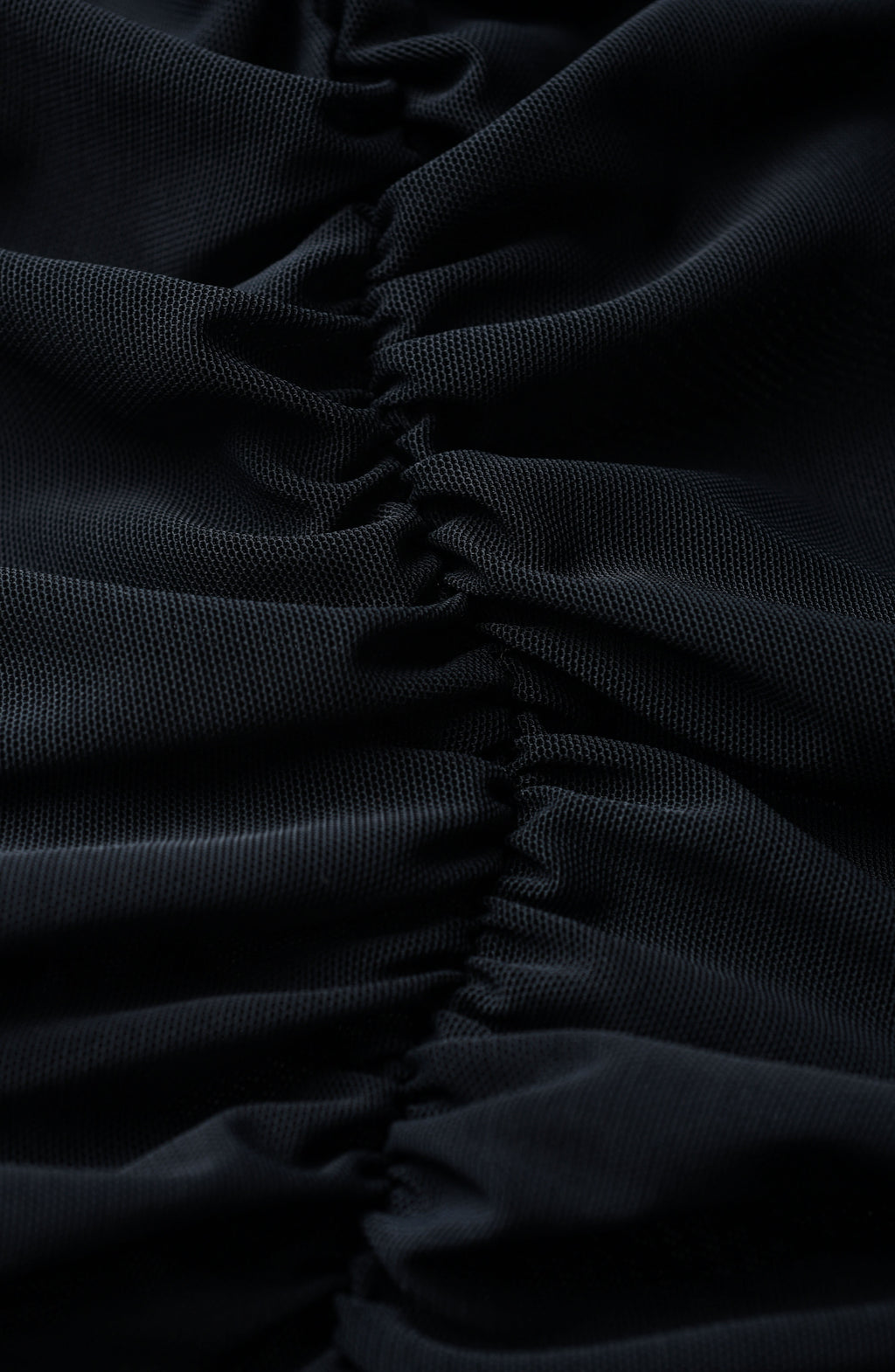 Close-up of black fabric with a ruched texture
