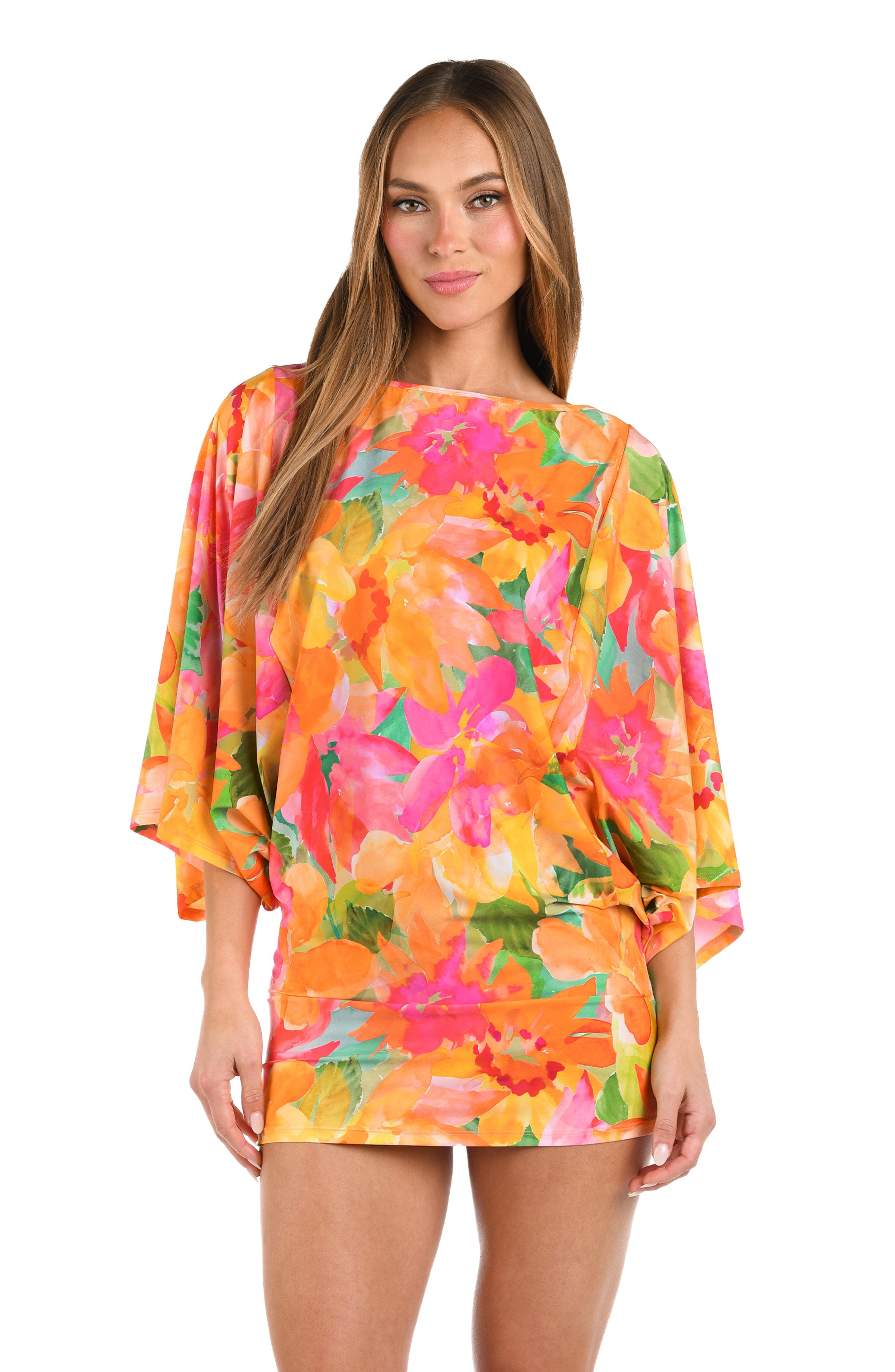 Front image of model wearing a scoop neck tunic cover up, with a vibrant, multicolor floral print featuring a straight silhouette and butterfly sleeves.