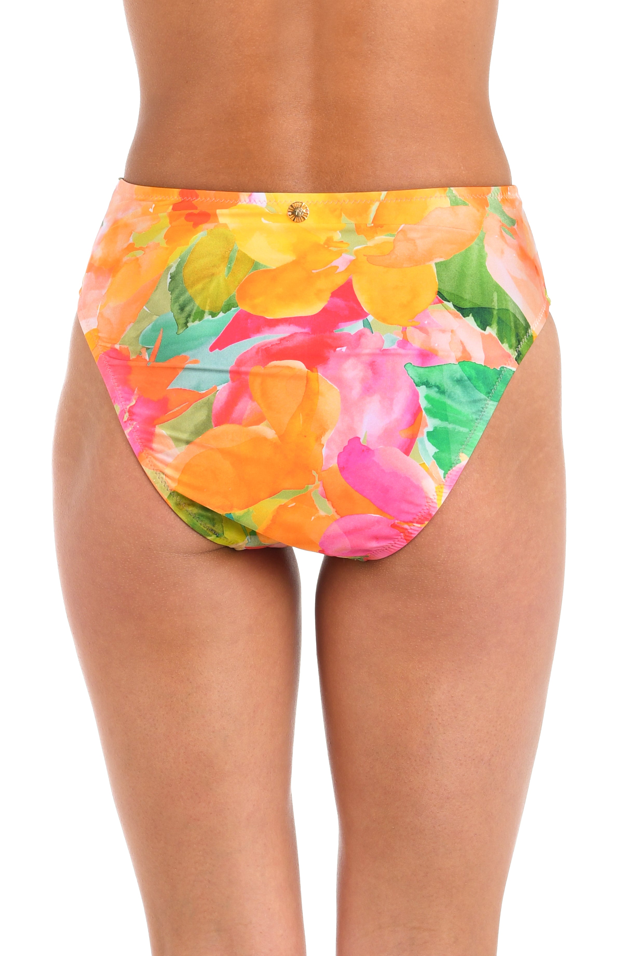 Close up back view of model wearing a high waisted bikini swimsuit bottom  showcasing a multicolored floral print and contemporary rear coverage.