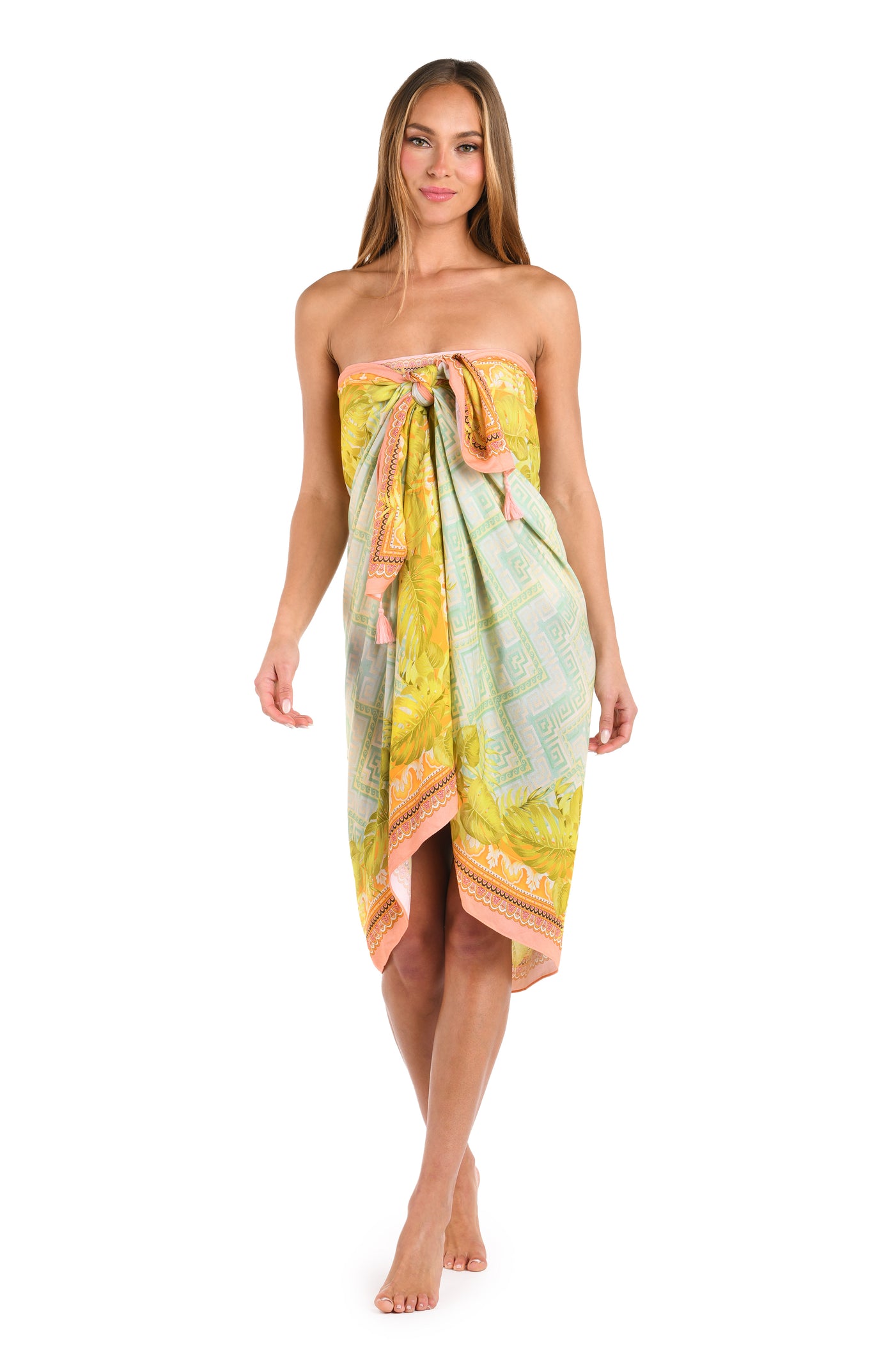 
                  
                    Full body front image of model wearing a multi-colored pastel yellow, green, and peach patterned pareo wrap cover up. 
                  
                