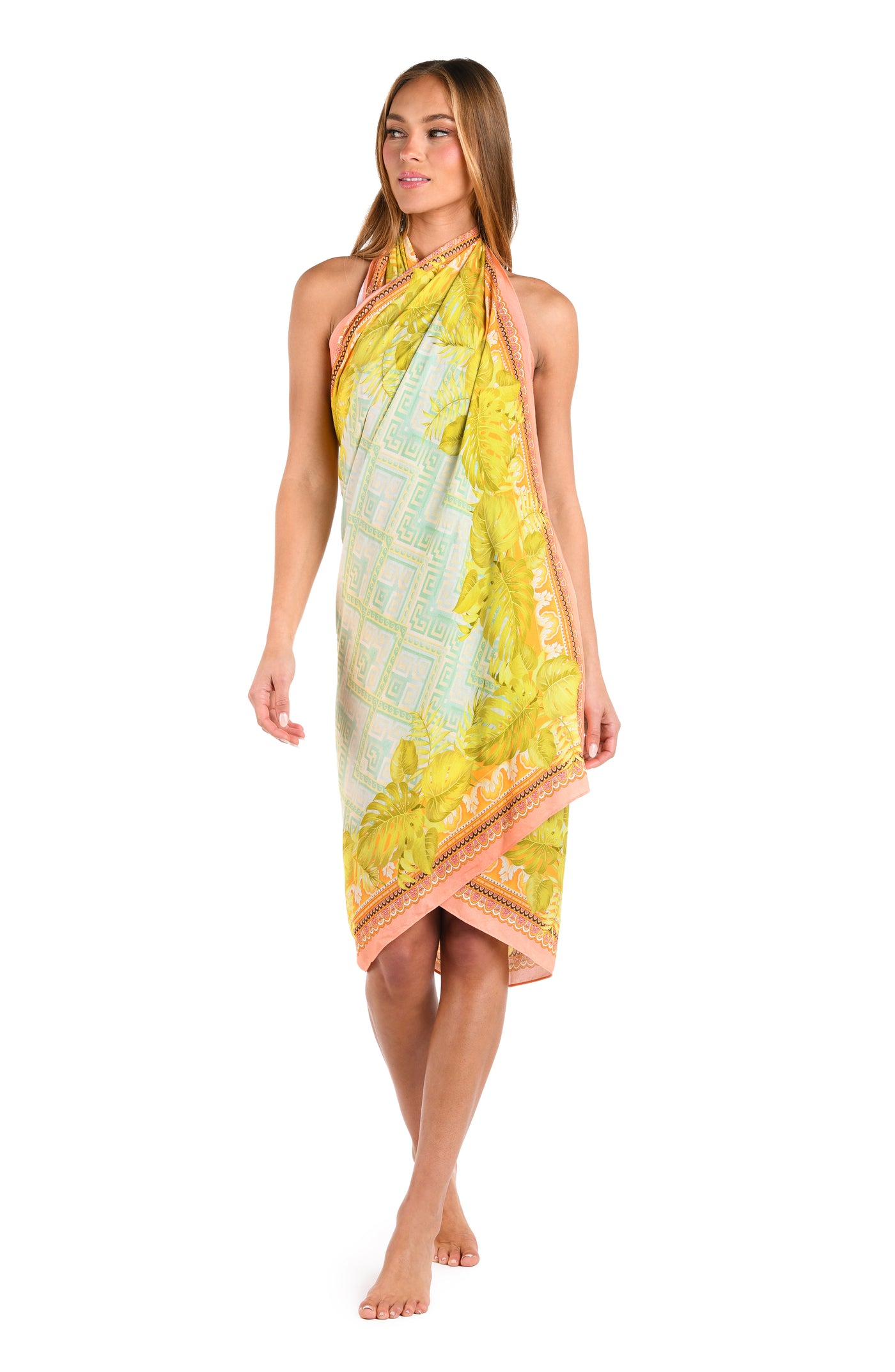 
                  
                    Full body front image of model wearing a multi-colored pastel yellow, green, and peach patterned pareo wrap cover up. 
                  
                