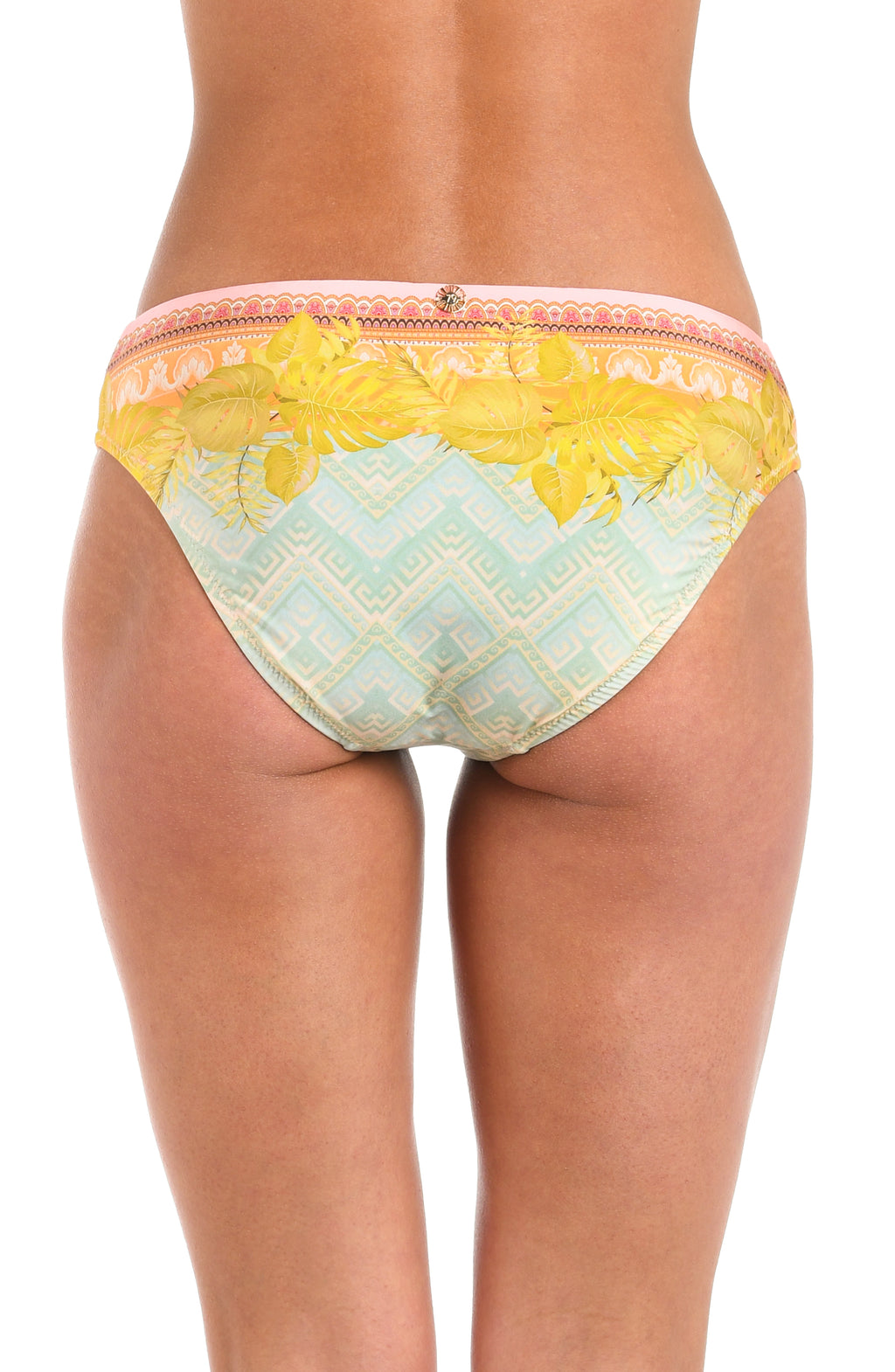Back image of model wearing a multi-colored pastel yellow, green, and peach patterned hipster bikini swimsuit bottom featuring moderate rear coverage.