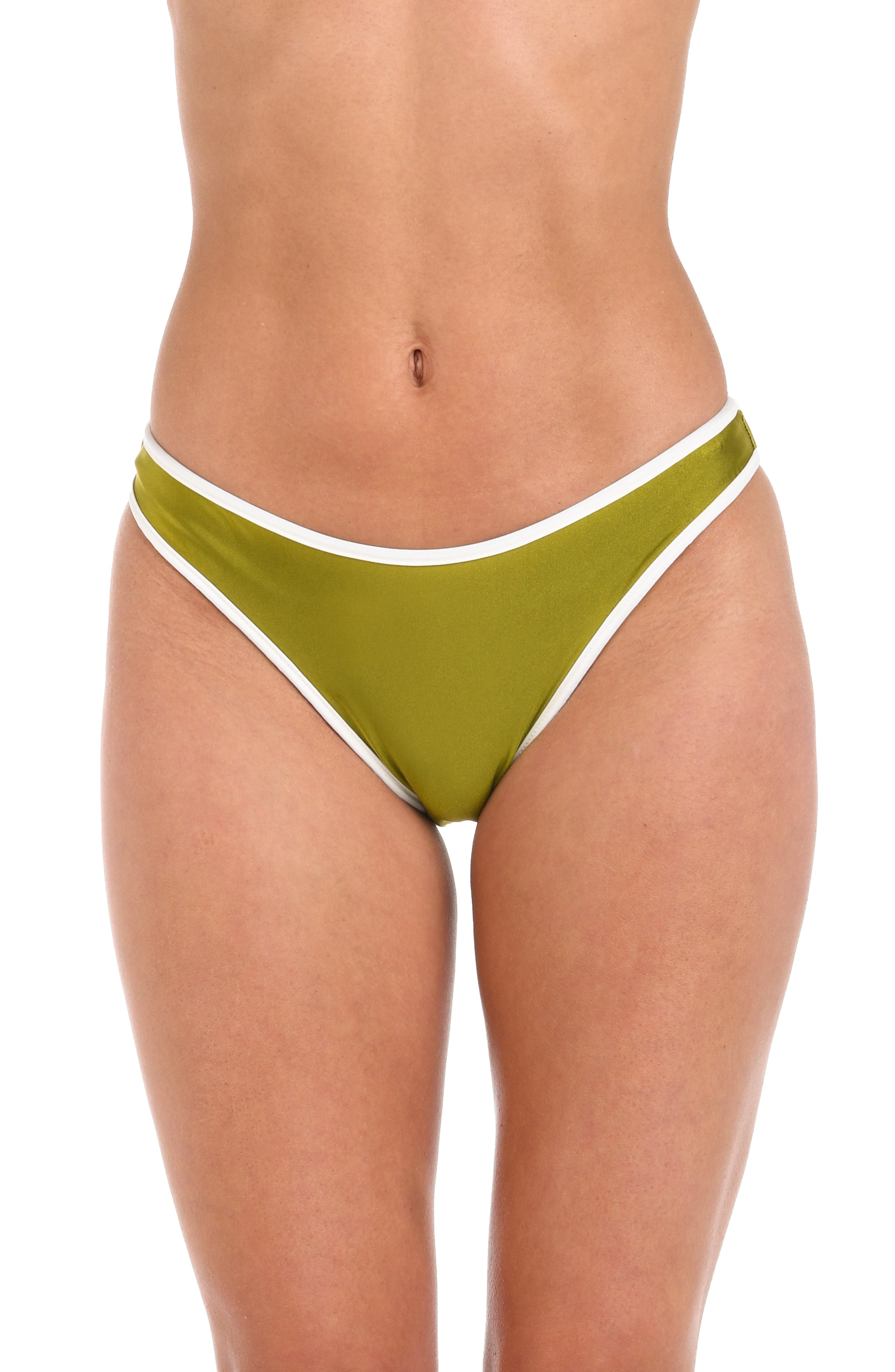 Front image of model wearing a reversible French cut bikini bottom: one side features a solid olive green color with white trim, while the other side showcases a bold black and white geometric print. 