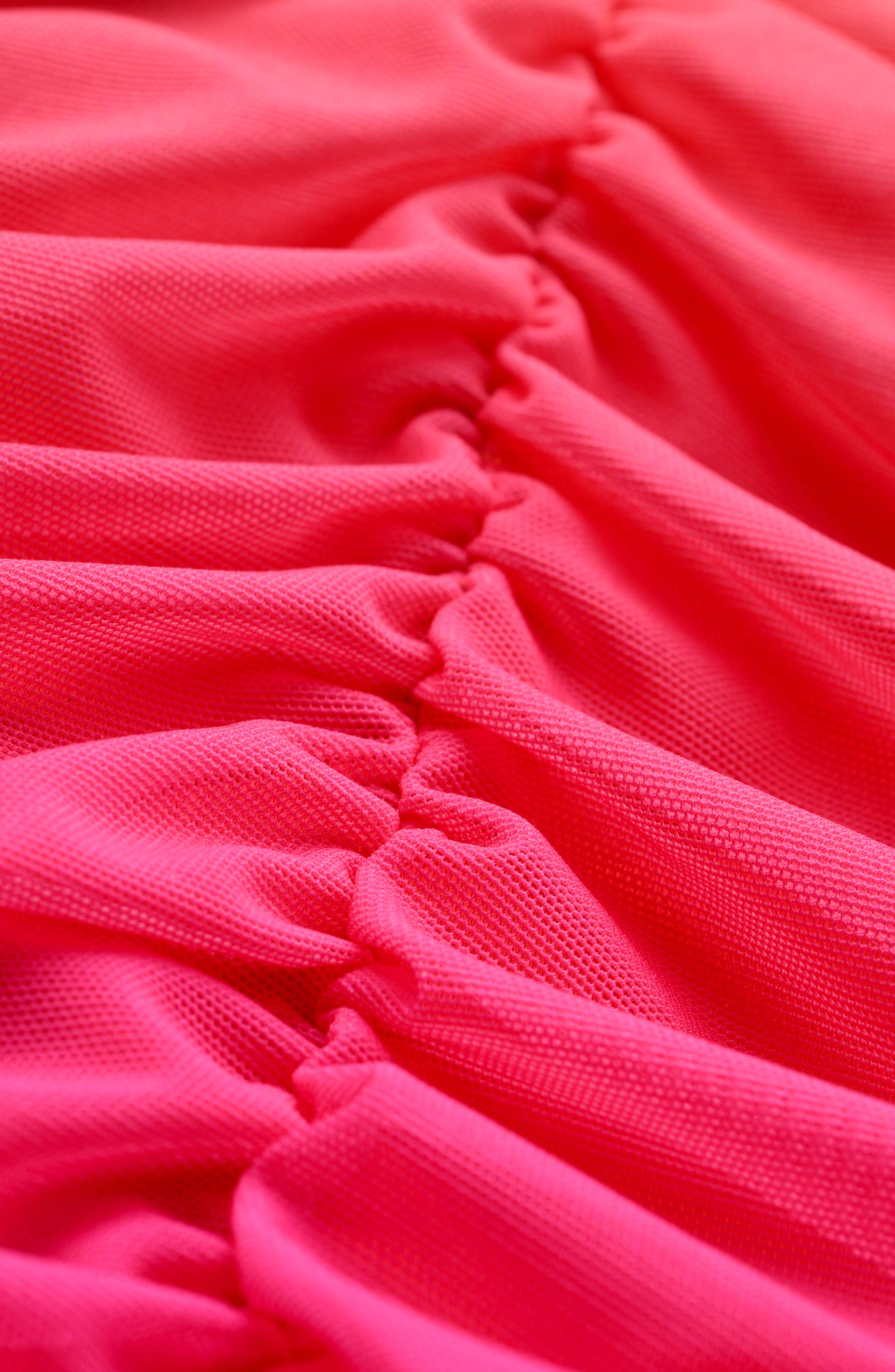 Close-up of pink fabric with ruched texture