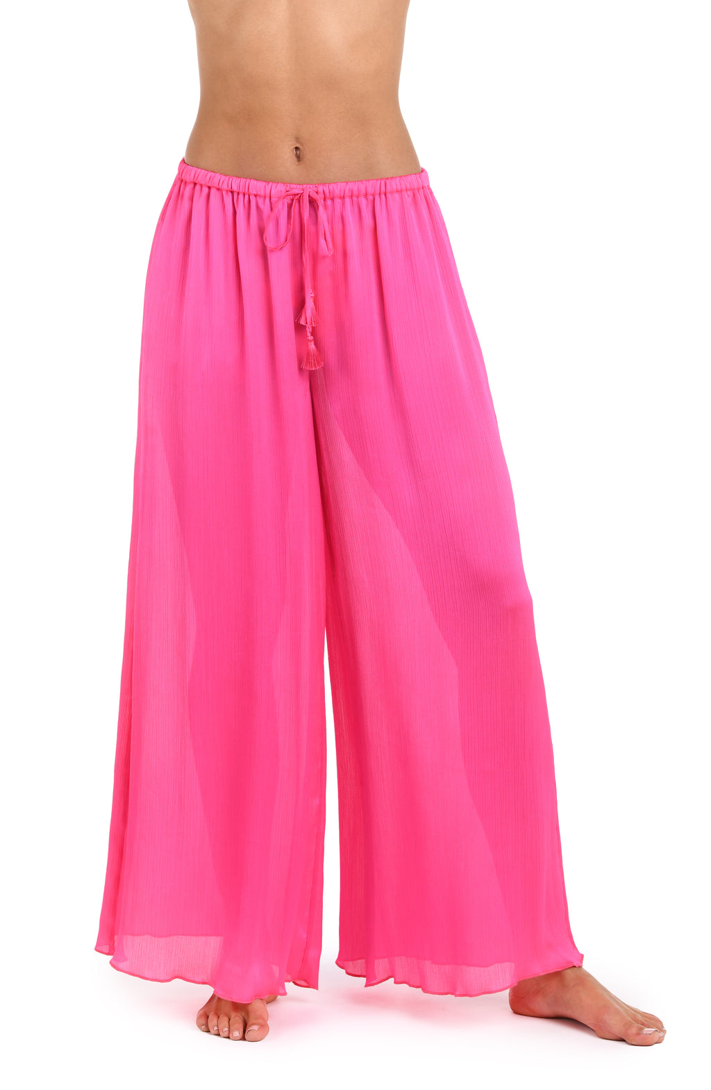 Front image of model wearing a solid bright pink crinkle pant cover up.       