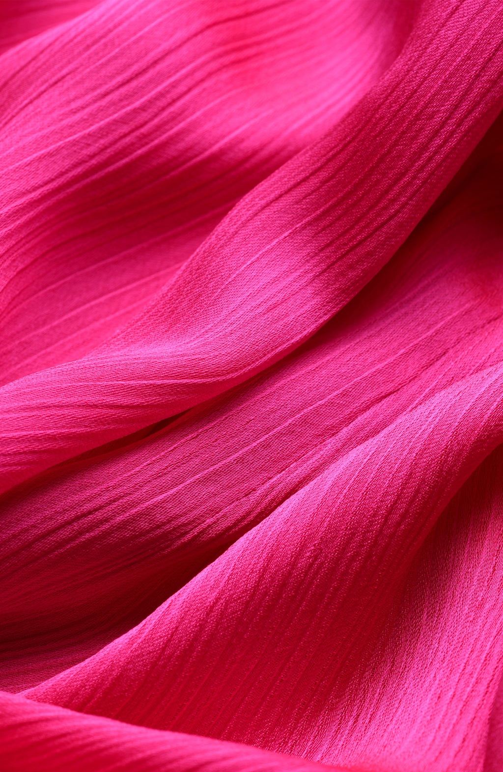 Close-up of pink fabric with a textured pattern