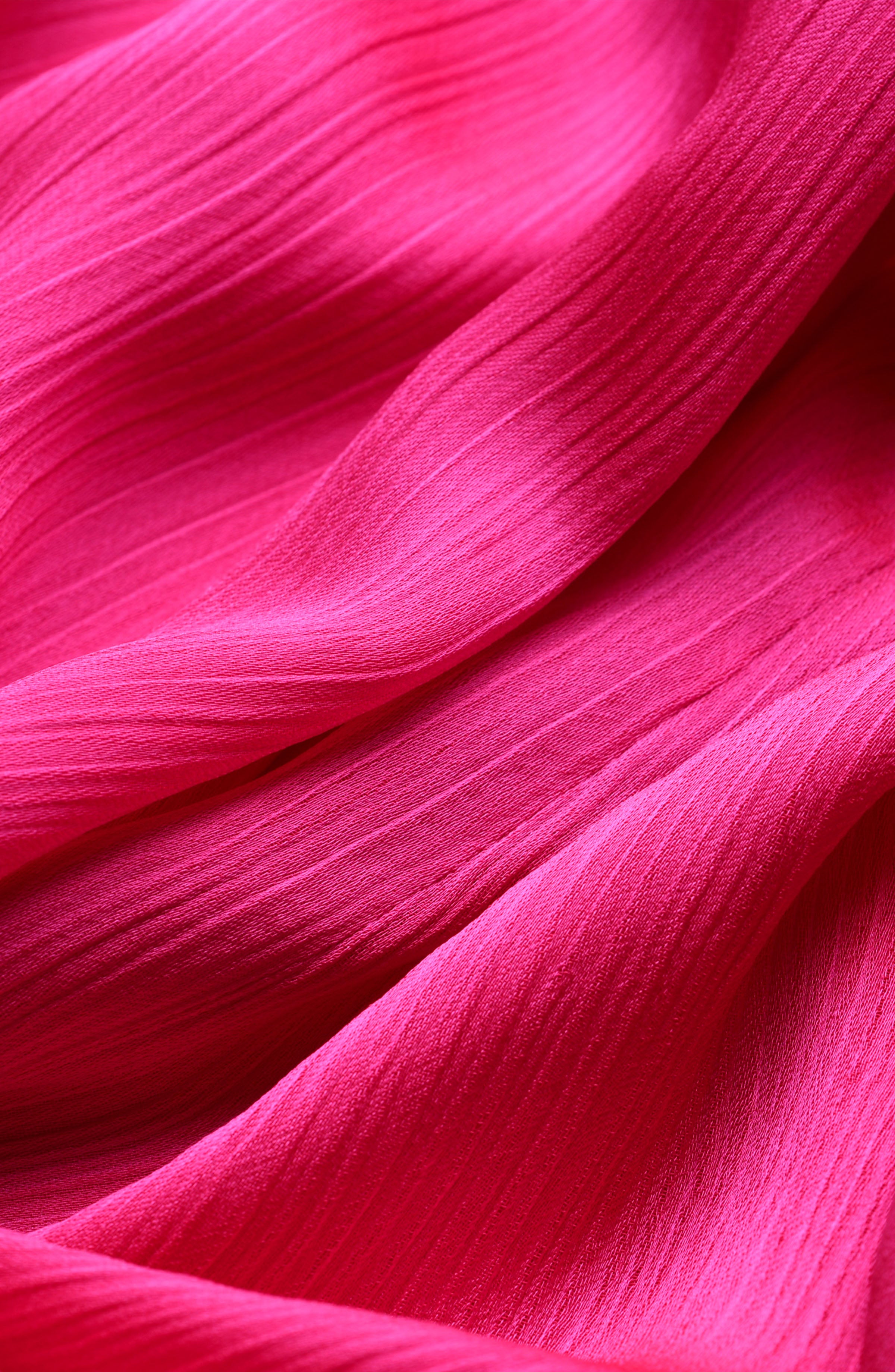 Close-up of pink fabric with a textured pattern