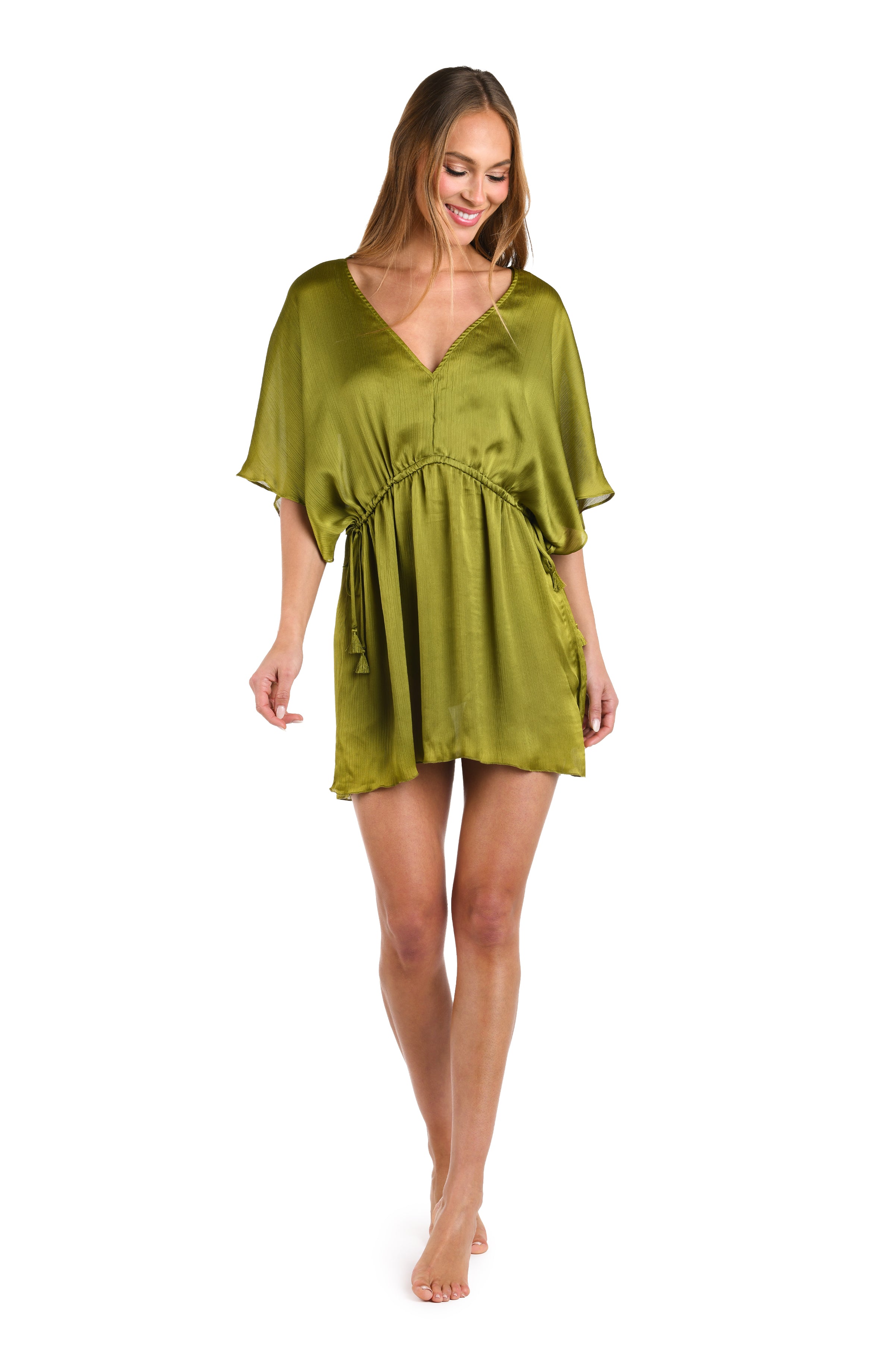 Full body front image of model wearing a solid olive v-neck tunic cover up.      