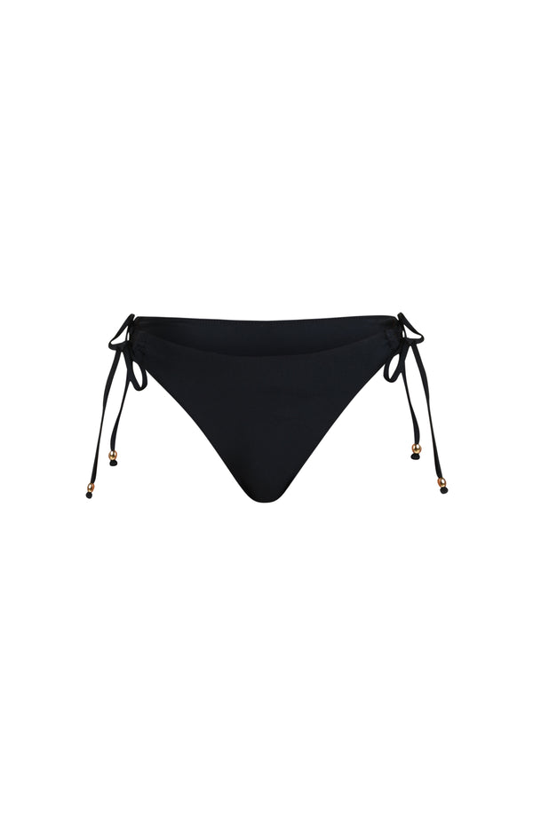 Floating image of solid black bikini bottoms with adjustable side  ties featuring gold dipped ends. 