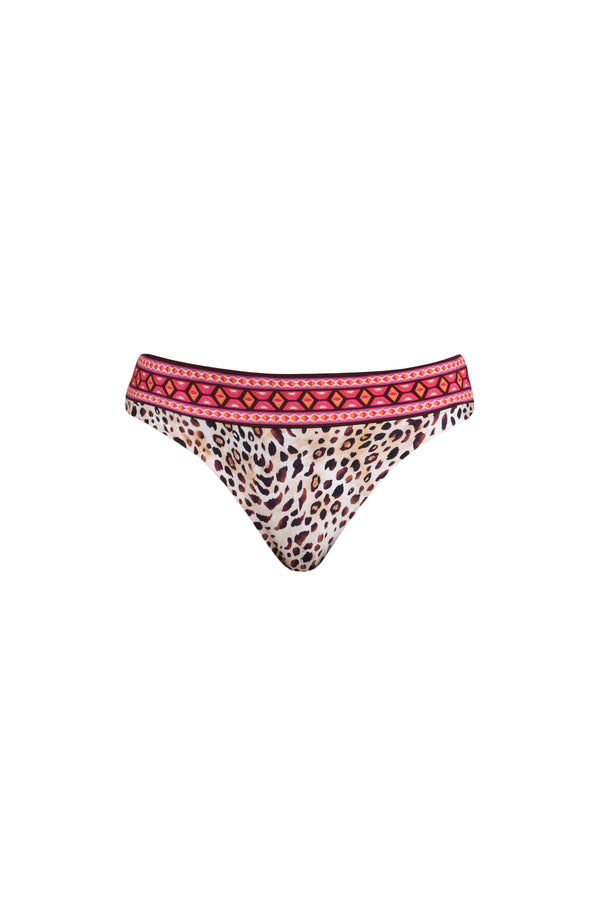 3D image of a multicolored printed reversible bikini bottom featuring leopard on one side and a tropical print on the other. It has an allover band and moderate rear coverage. 