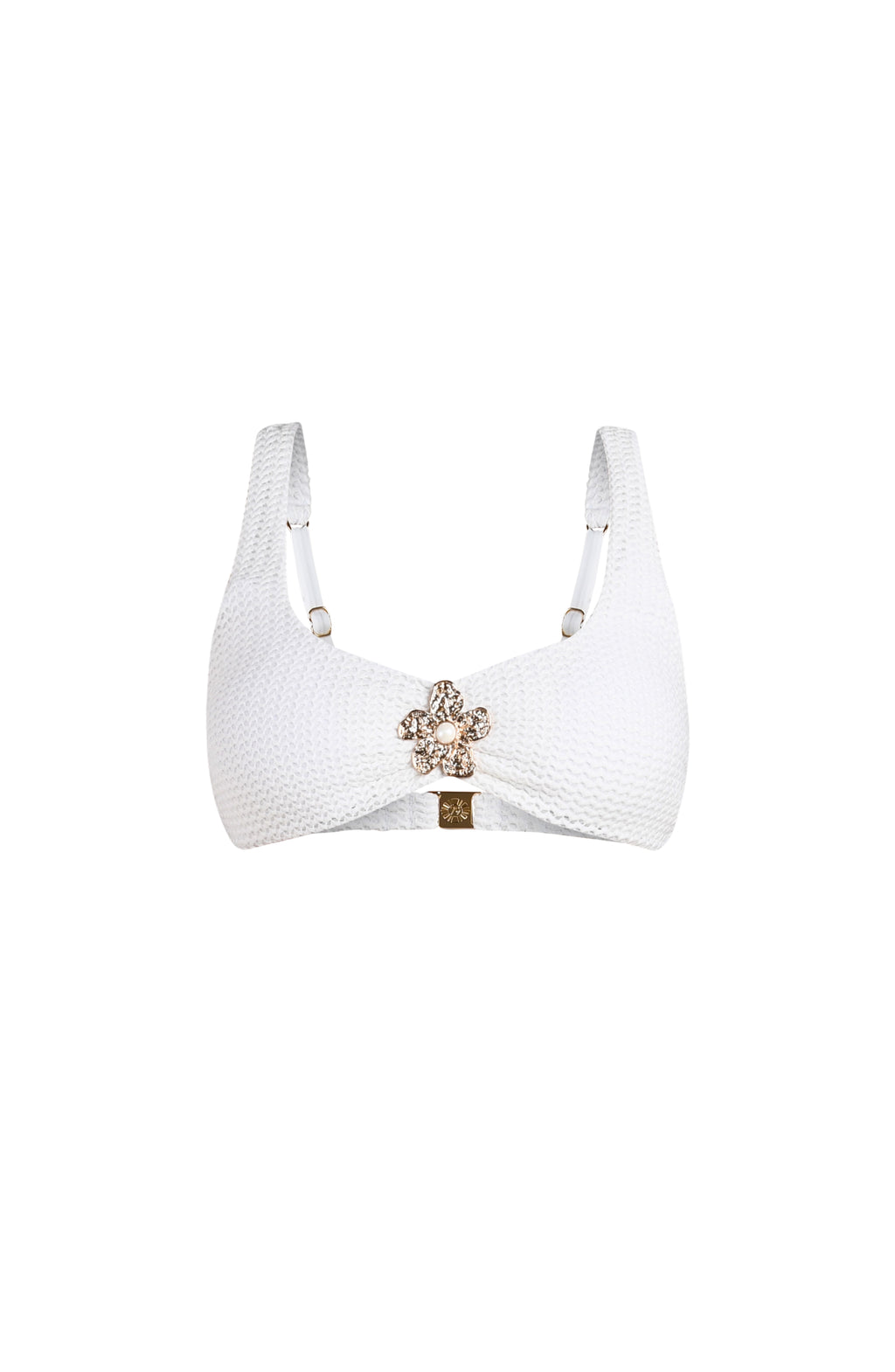 Ivory colored bikini top with a decorative clasp on a white background