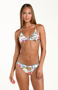 Woman wearing a colorful bikini top and matching bottom on a white background