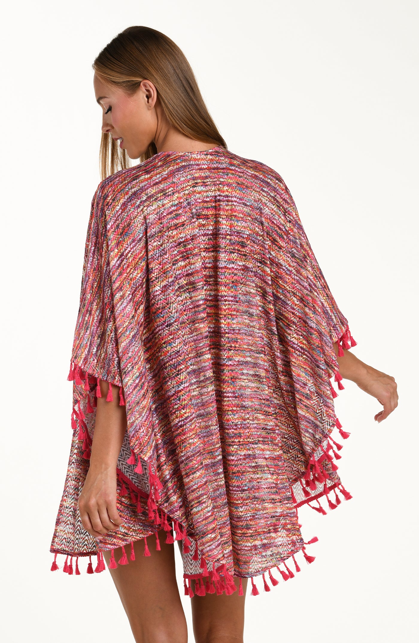 
                  
                    Back image of model wearing an open front kimono cover up with three quarter sleeves and tassel trim featuring a multicolored ripple print.
                  
                