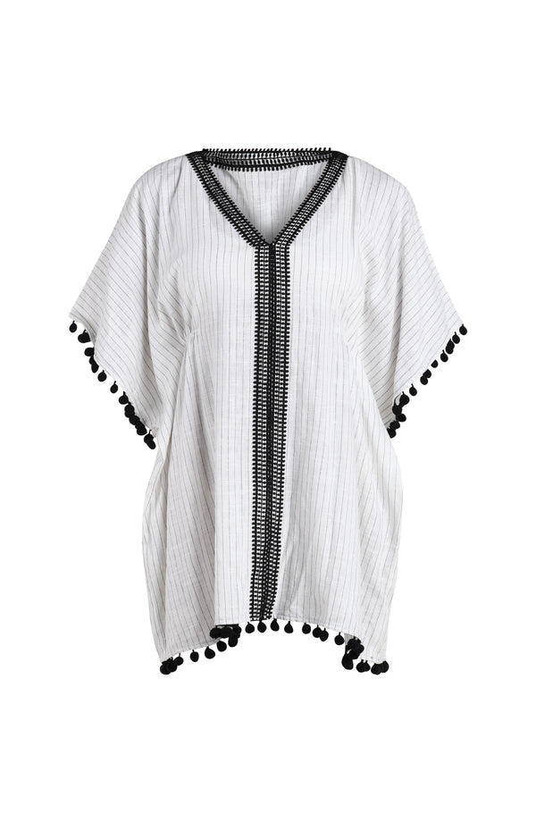 Floating image of a short pull over v-neck caftan with three quarter sleeves adorned with tassel trim. Featuring a cream colored linen print.