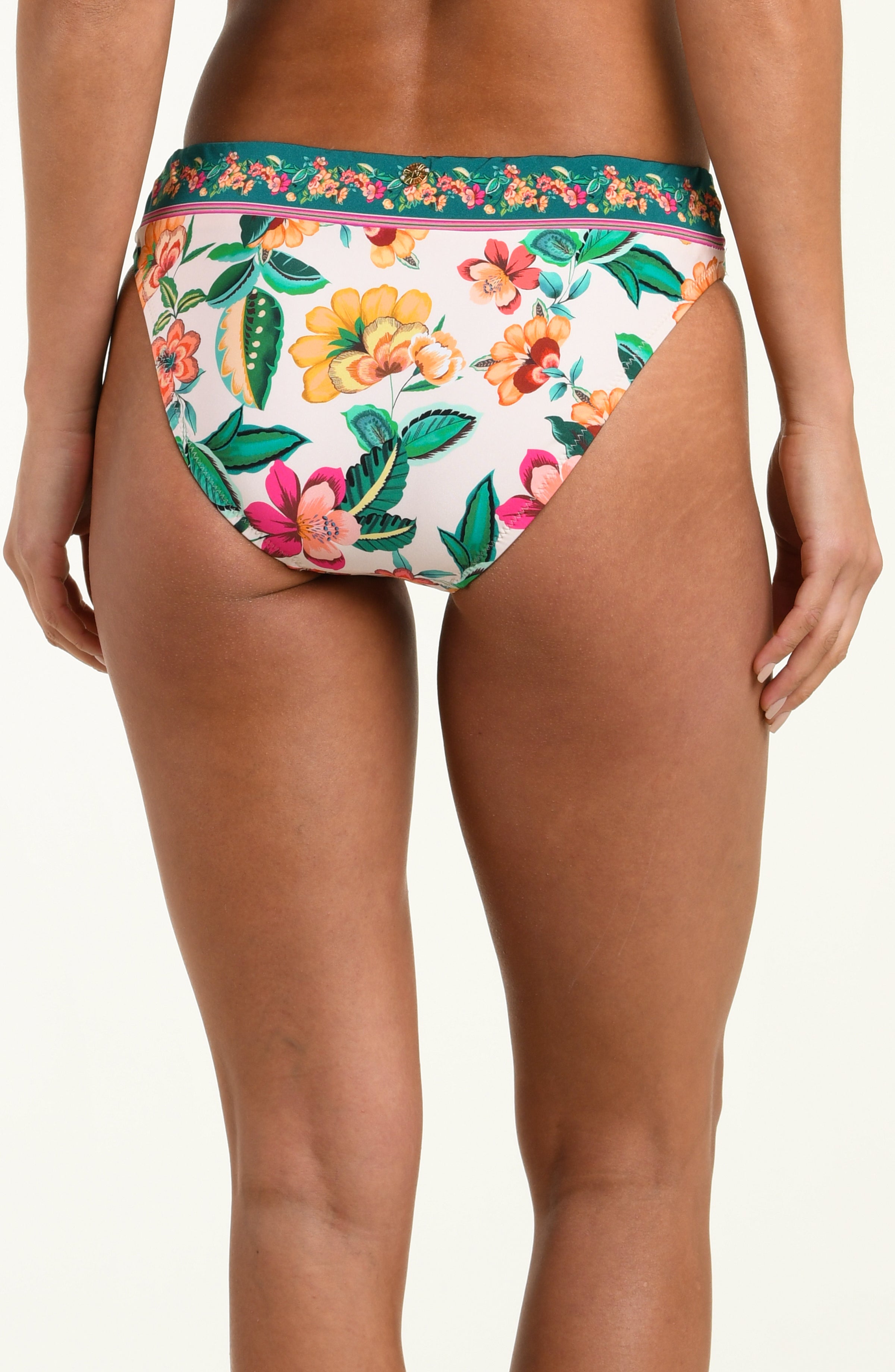 Multicolored floral-patterned bikini bottom worn by a person on a white background