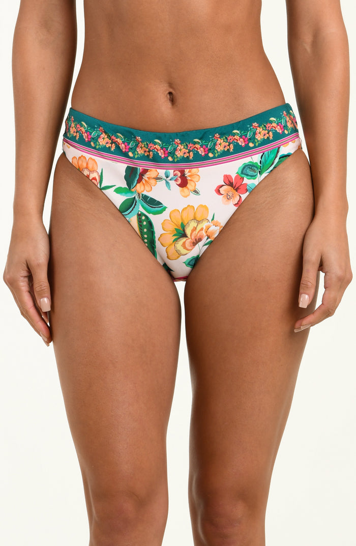 Multicolored floral-patterned bikini bottom worn by a person on a white background