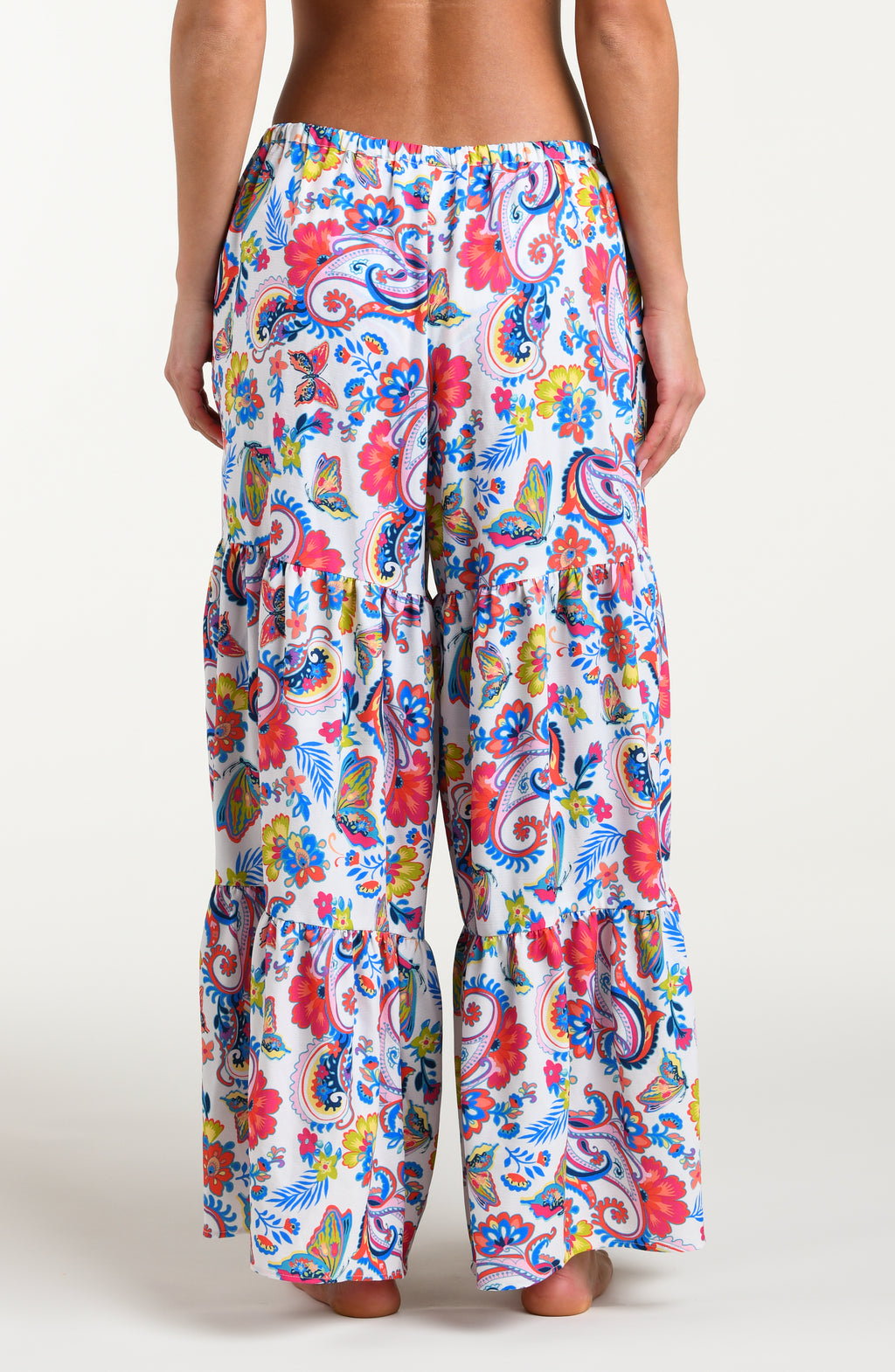 Multicolored beach pants against a white background. 