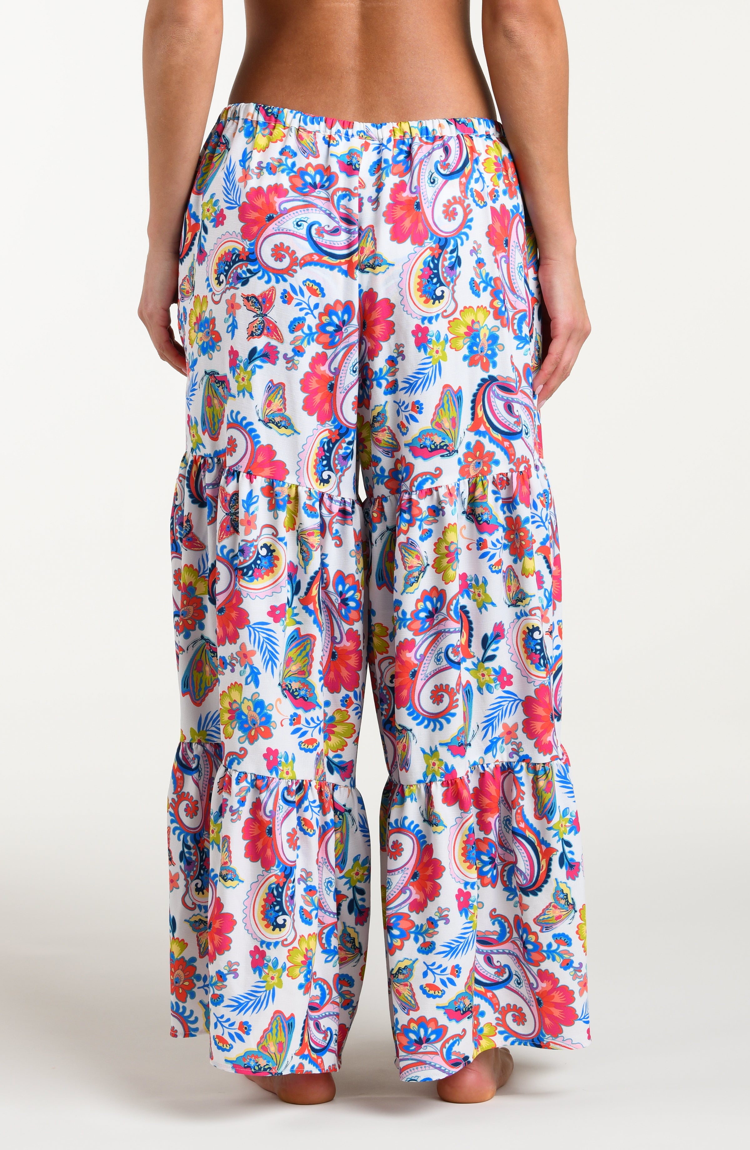 Multicolored beach pants against a white background. 
