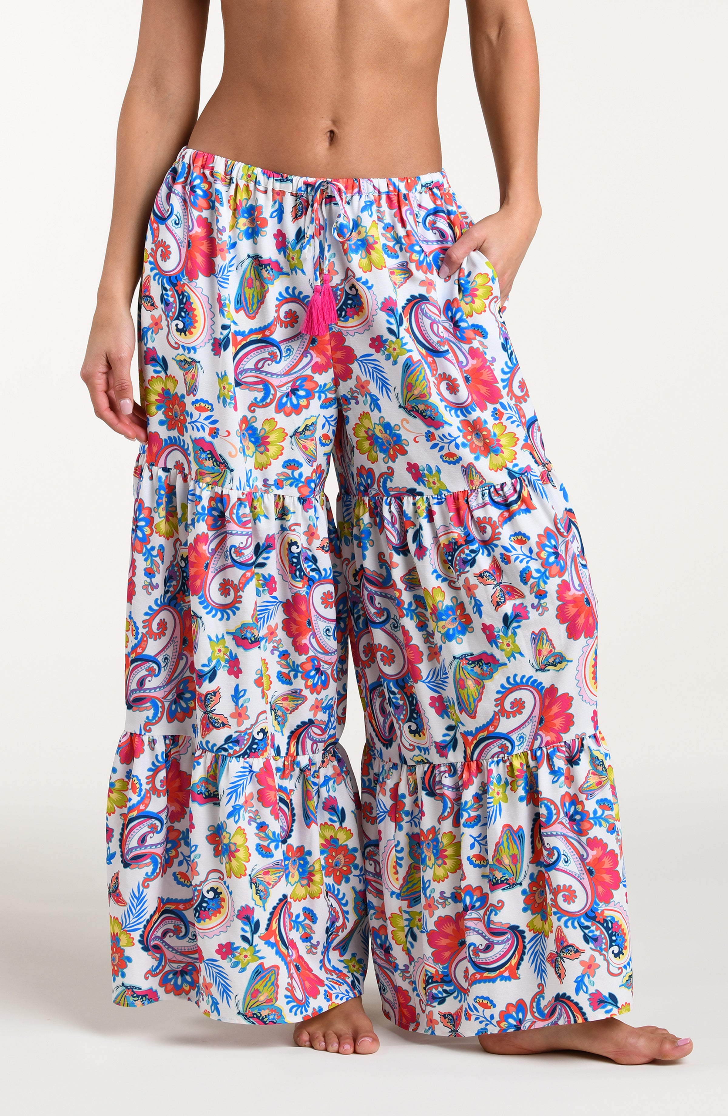 Multicolored beach pants against a white background. 