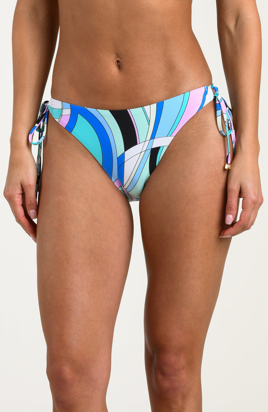 Multicolored bikini bottoms worn by a person against a white background. 