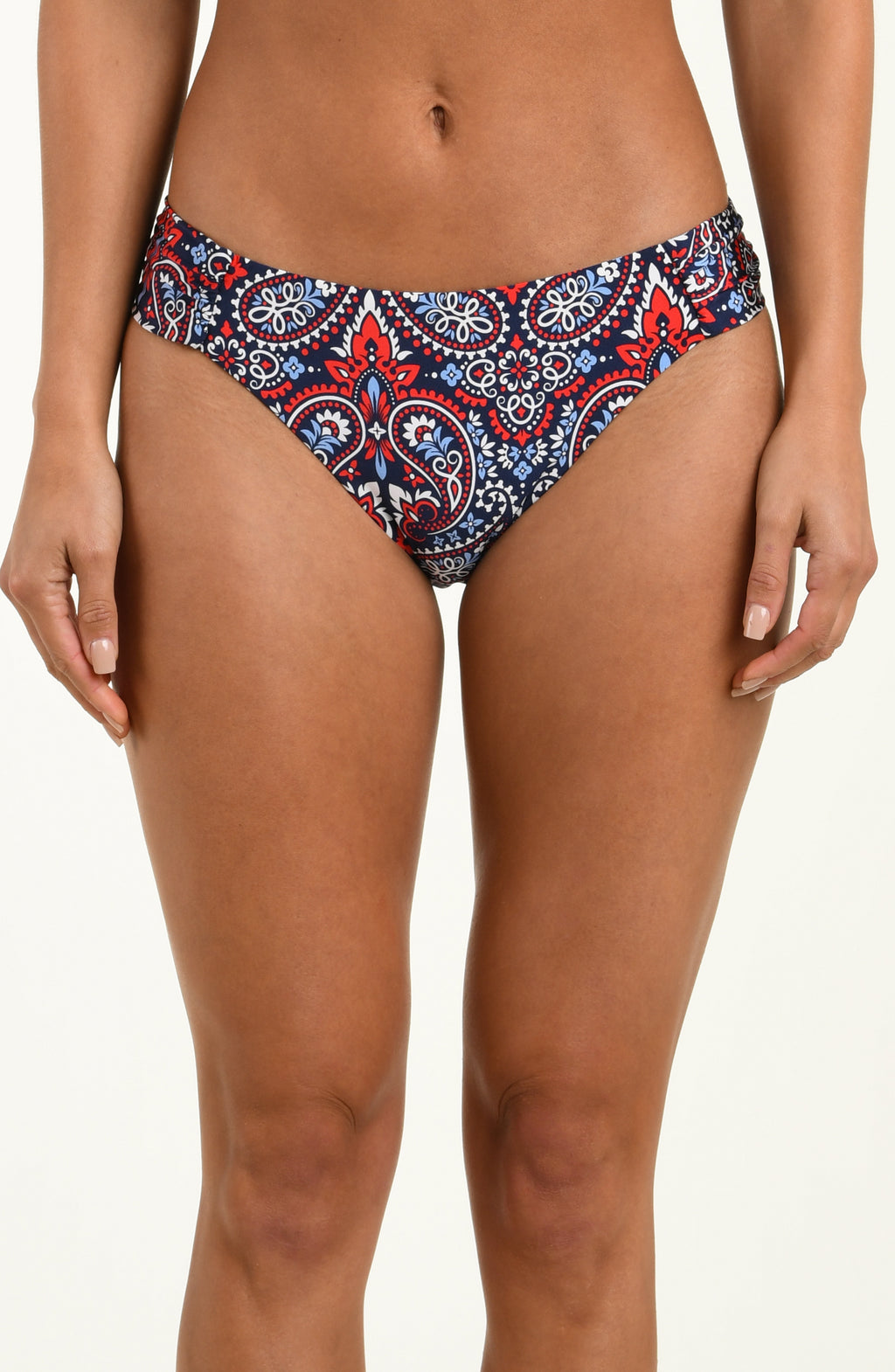 Multicolored bikini bottom worn by a person on a plain background