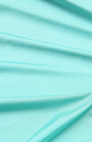 Detail image of a Sunshine 79 Sunshine Solids Pull-On Faux Pareo Cover Up in Seaglass.