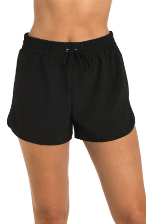 Front image of model wearing the 24th & Ocean Solid Woven Board Short.