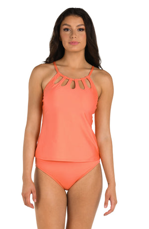 Front image of model wearing the 24th & Ocean Solid Underwire Cutout High Neck Tankini Top in Coral.