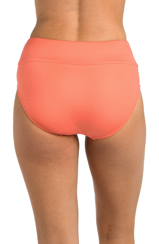 Back image of model wearing the 24th & Ocean Solid High Waist Bottom in Coral.